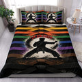 Karate duvet cover set displayed on a bed with colorful belt stripes and martial arts silhouette artwork