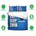 Swimming bedding set displayed with blue swimmer artwork and breathable, machine washable fabric feature icons