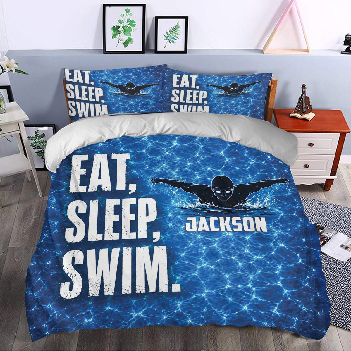 Swimming duvet cover set styled in a modern bedroom with blue pool water design and bold swimmer artwork