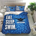 Blue swimming bedding set on a bright bedroom with swimmer design, water ripple pattern, and matching pillowcases