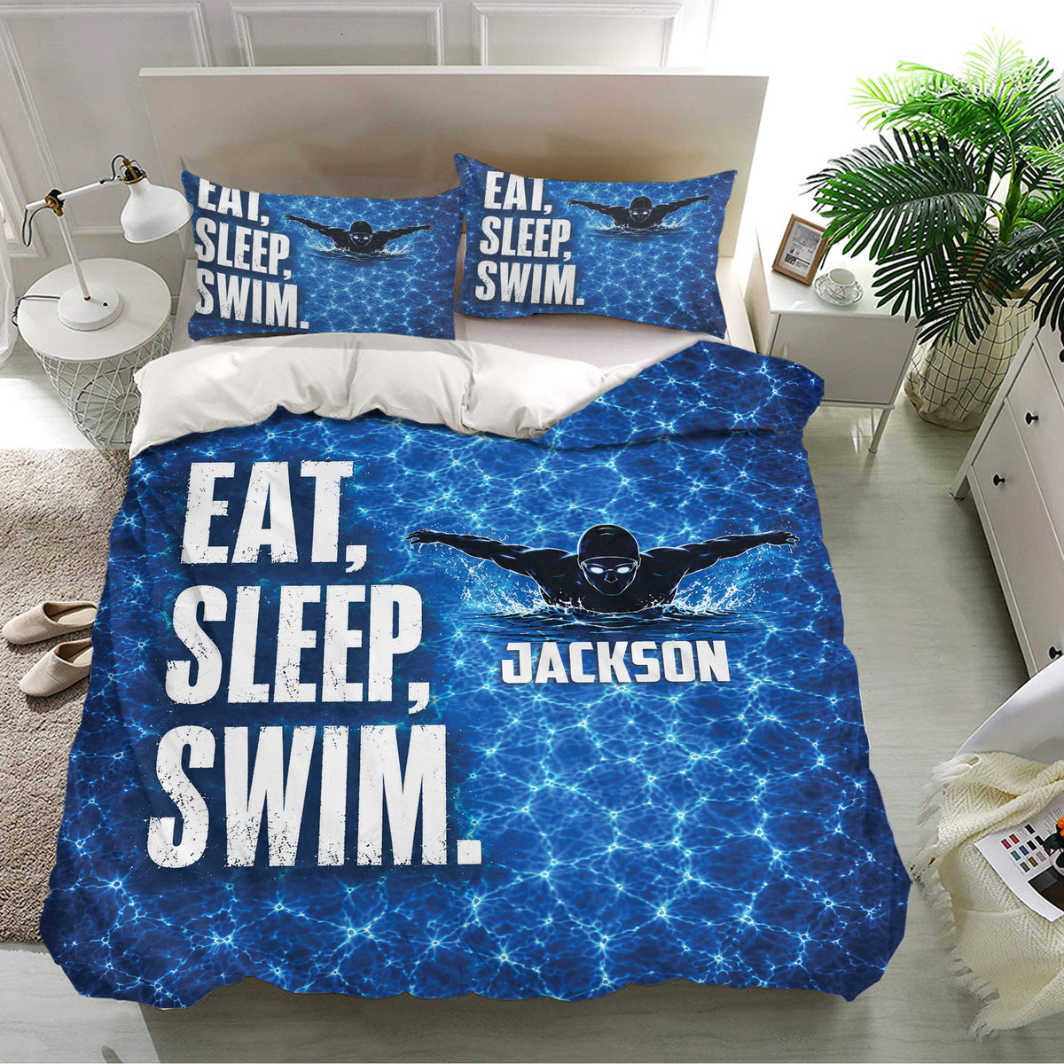 Blue swimming bedding set on a bright bedroom with swimmer design, water ripple pattern, and matching pillowcases