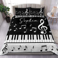 Black and white piano duvet cover set with musical notes, treble clefs, and keyboard keys