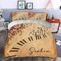 Piano duvet cover bedding set styled in a bedroom with vintage floral music decor and keyboard artwork