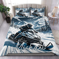 Snowmobile duvet cover set displayed on a bed with blue and white mountain scenery and matching pillowcases