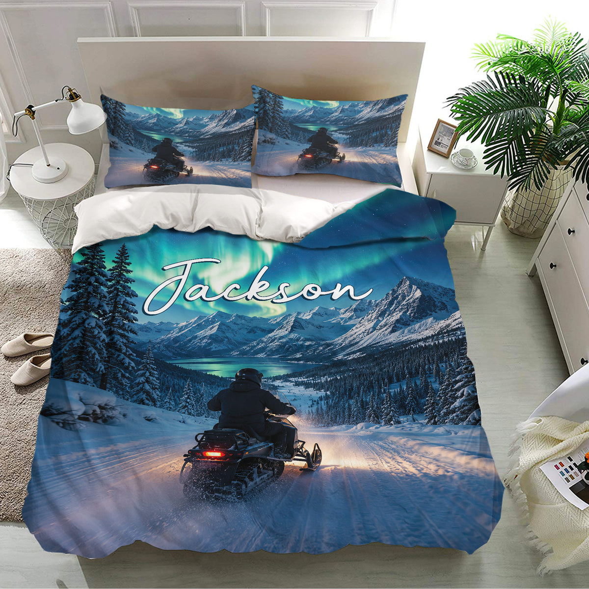 Snowmobile bedding set displayed in a bright bedroom with matching pillowcases and winter mountain adventure artwork