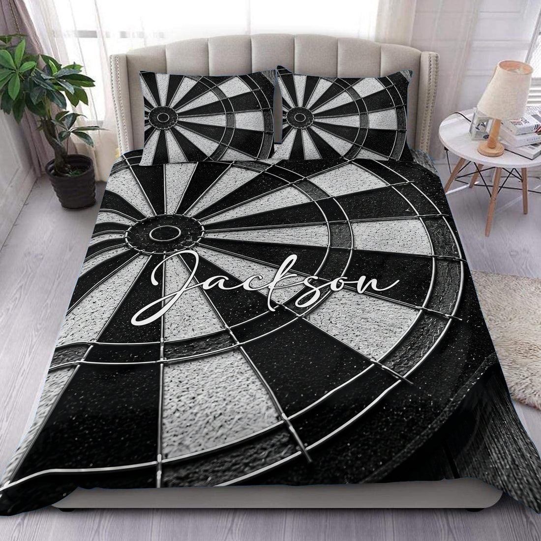 Black and white dart board duvet cover set styled on a modern bedroom with matching pillows