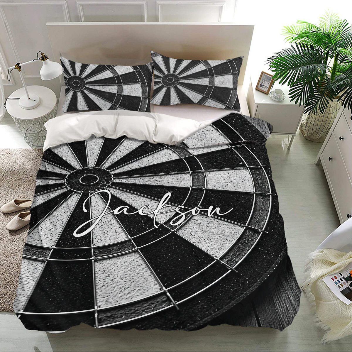 Dart board bedding set presented in a bright bedroom with bold black and white target artwork