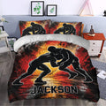 Wrestling duvet cover bedding set styled in a bedroom with dramatic red, orange, black, and white artwork