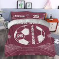 Maroon soccer duvet cover set styled in a bedroom with stadium artwork and large soccer ball design