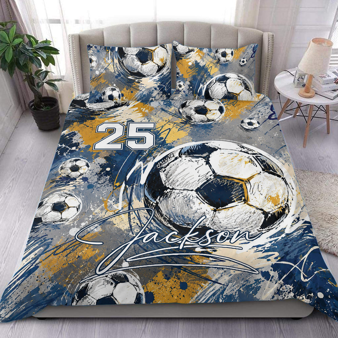 Soccer duvet cover set displayed on a bed with blue, gold, and white abstract ball artwork