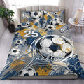 Soccer duvet cover set displayed on a bed with blue, gold, and white abstract ball artwork