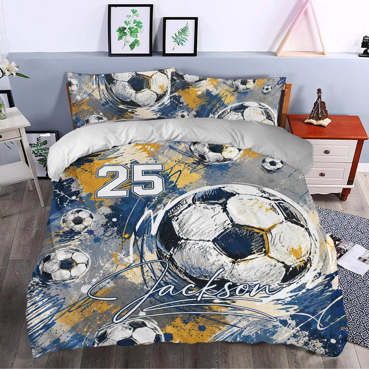 Soccer bedding displayed in a bedroom with illustrated balls and energetic blue and gold accents