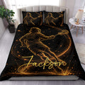 Black and gold lacrosse duvet cover set displayed on a bed with player artwork and starry motion trails