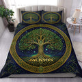 Tree Of Life duvet cover set displayed on a bed with a navy celestial background and gold Celtic border