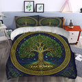Tree Of Life duvet cover styled in a bedroom with leafy branches, golden roots, and deep navy artwork
