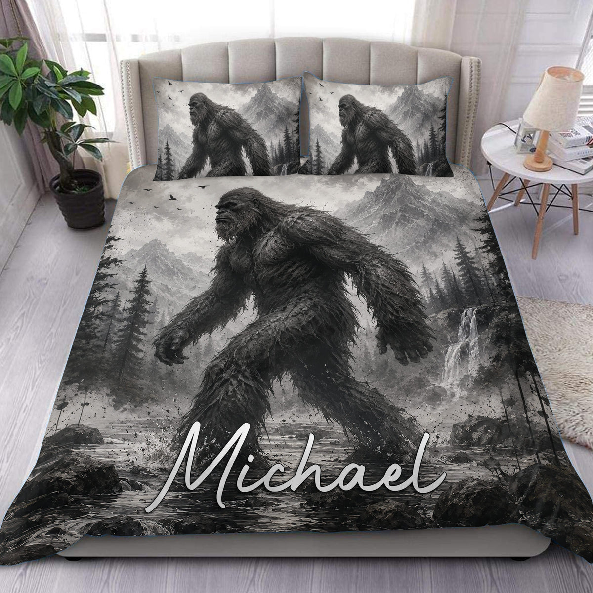Bigfoot duvet cover set displayed on a bed with grayscale mountain, forest, and waterfall artwork