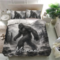 Bigfoot bedding set displayed in a bright bedroom with matching grayscale mountain artwork