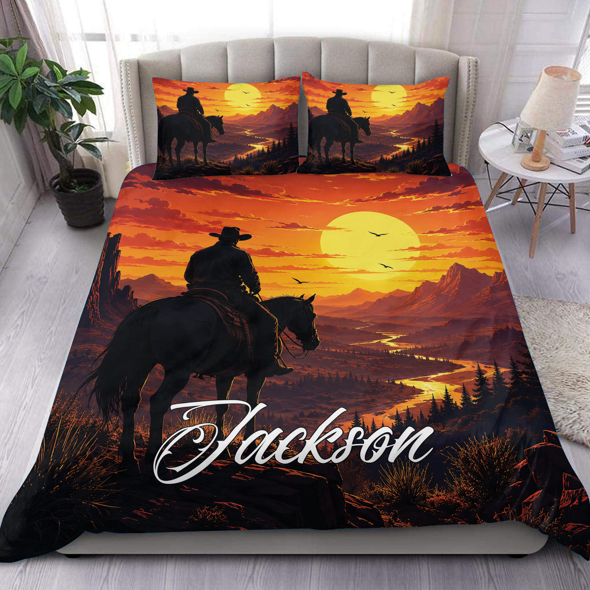 Cowboy duvet cover set displayed on a bed with a rider, horse, mountains, sunset, and winding river design