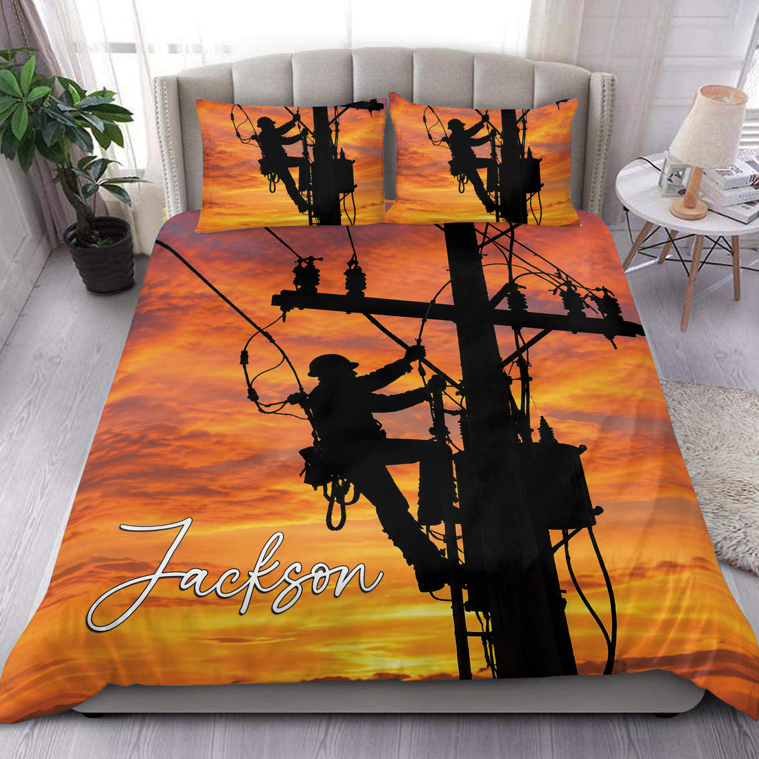 Lineman duvet cover set displayed on a bed with utility worker silhouettes against a vivid orange sunset