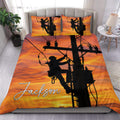 Lineman duvet cover set displayed on a bed with utility worker silhouettes against a vivid orange sunset