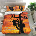 Lineman bedding set displayed in a bright bedroom with utility pole artwork, orange skies, and matching pillowcases