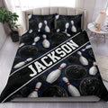 Bowling duvet cover set displayed on a bed with dark blue artwork, bowling balls, pins, and bold lettering