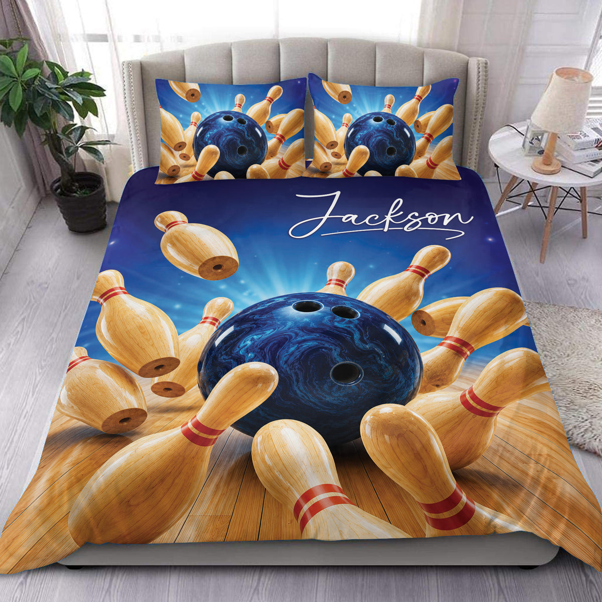 Custom bowling duvet cover set displayed on a bed with blue cosmic artwork, bowling balls, and wooden pins