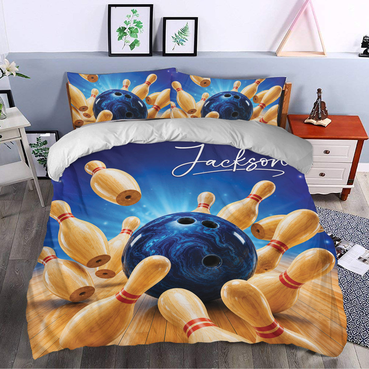 Bowling bedding displayed in a bedroom with vivid blue artwork, bowling pins, and bowling balls