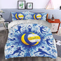 Volleyball bedding set styled in a bedroom with blue and yellow volleyball artwork and player silhouettes