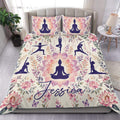 Yoga duvet cover set on a bed with meditation silhouettes, lotus flowers, butterflies, and floral artwork