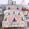 Yoga duvet cover set styled in a bedroom with purple meditation figures, pink lotus flowers, and botanical accents