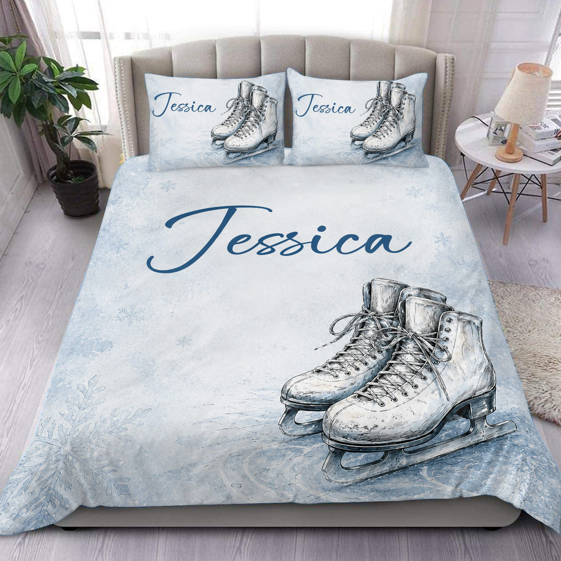 Ice skating duvet cover set displayed on a bed with blue snowflake artwork and skate illustrations