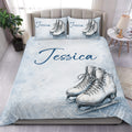 Ice skating duvet cover set displayed on a bed with blue snowflake artwork and skate illustrations