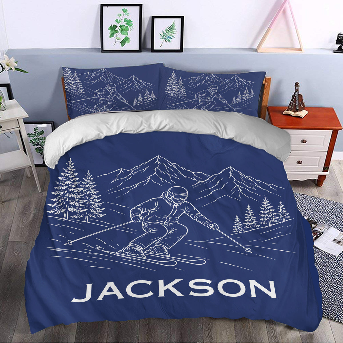 Navy skiing duvet cover set styled in a bedroom with mountain and skier artwork
