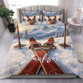 Skiing duvet cover set displayed on a bed with snowy mountains, vintage skis, and a custom design
