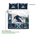 Skiing duvet cover set showing a skier design, crossed skis, mountain artwork, and navy tones