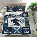 Navy skiing duvet cover set styled in a bright bedroom with matching goggle pillowcases