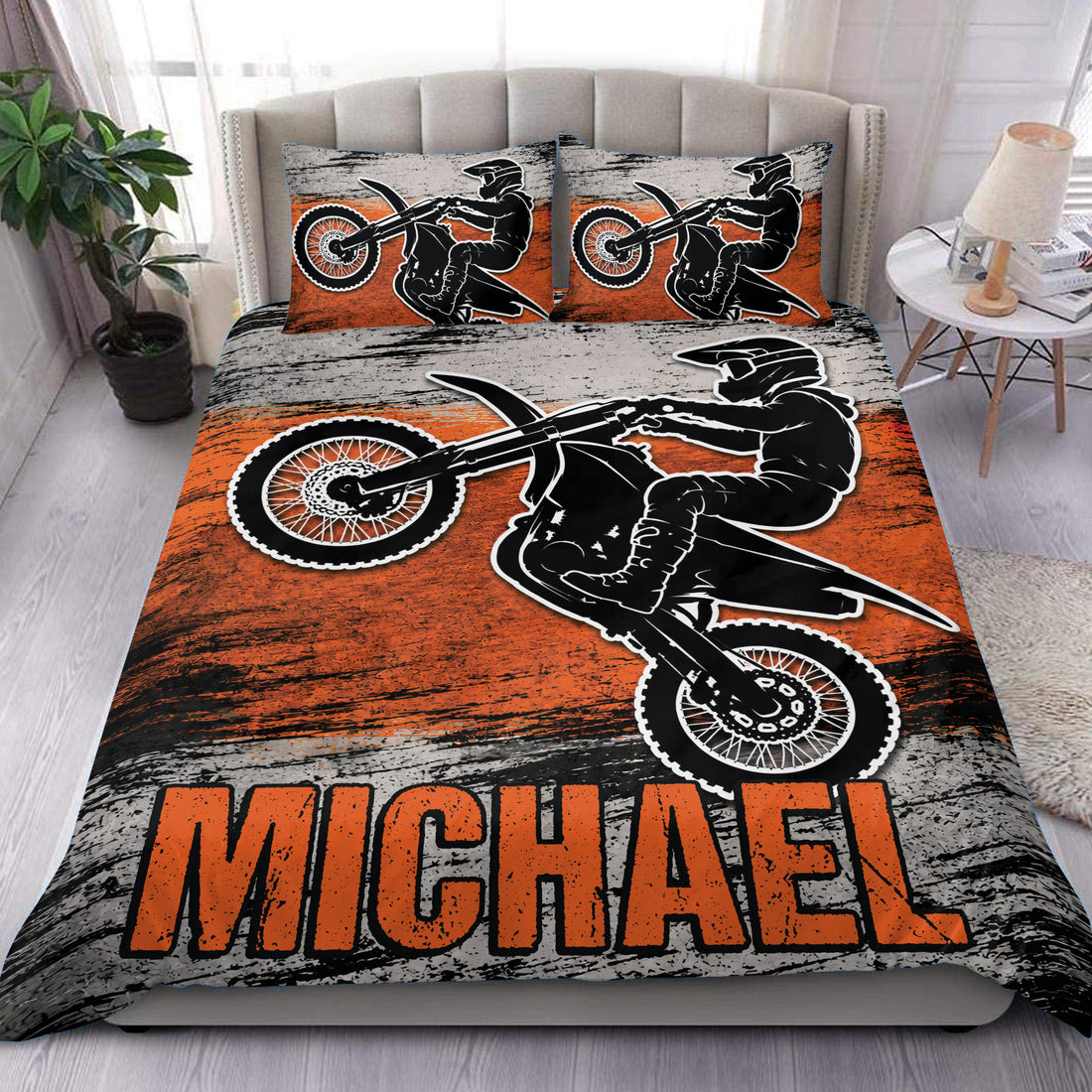 Motocross duvet cover set with black dirt bike rider artwork, orange accents, and matching pillowcases