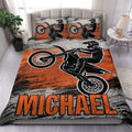 Motocross duvet cover set with black dirt bike rider artwork, orange accents, and matching pillowcases