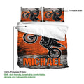 Motocross duvet cover set showing the printed side, orange dirt bike artwork, and lightweight fabric detail
