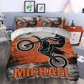 Motocross duvet cover styled in a modern bedroom with bold orange, black, and gray dirt bike artwork