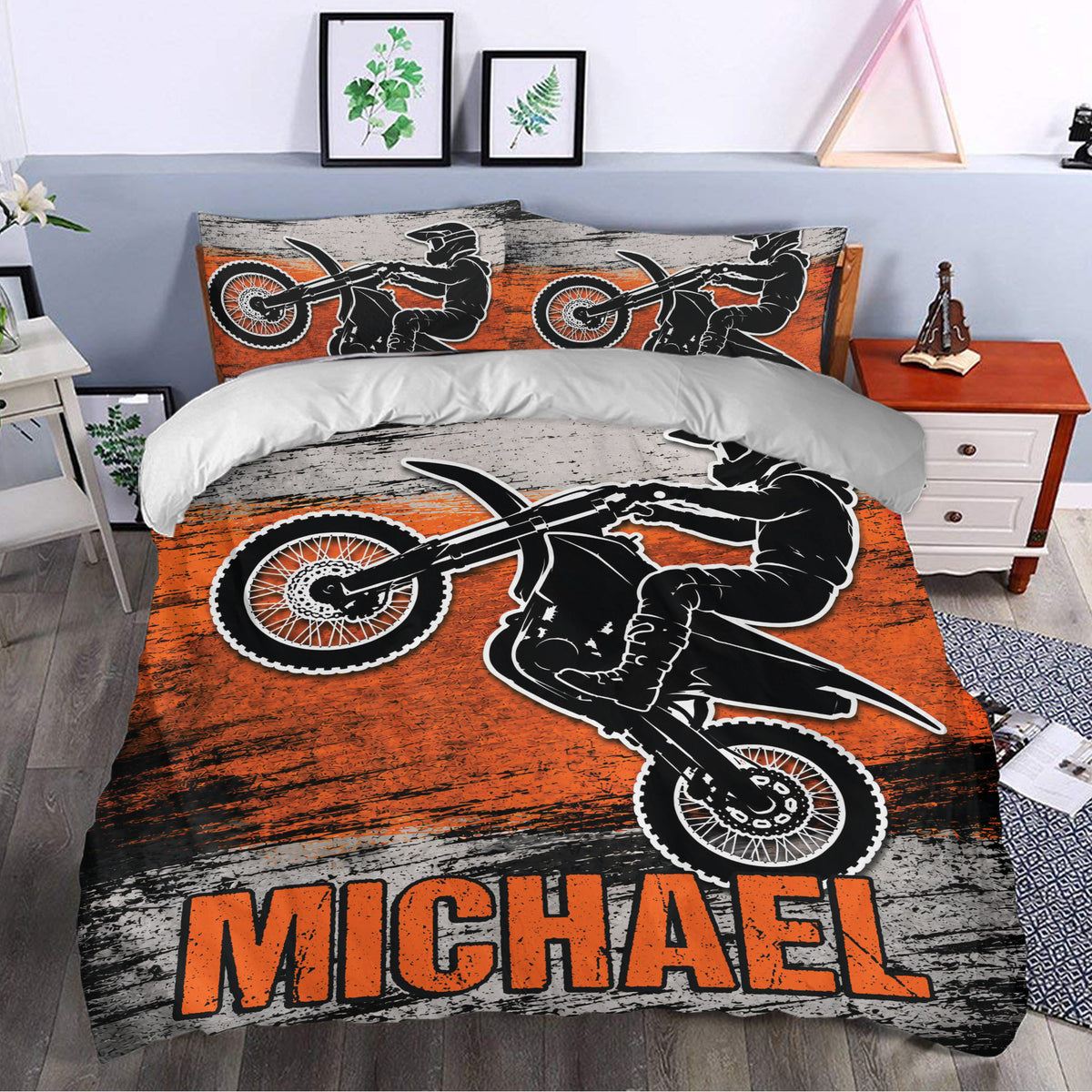 Motocross duvet cover styled in a modern bedroom with bold orange, black, and gray dirt bike artwork
