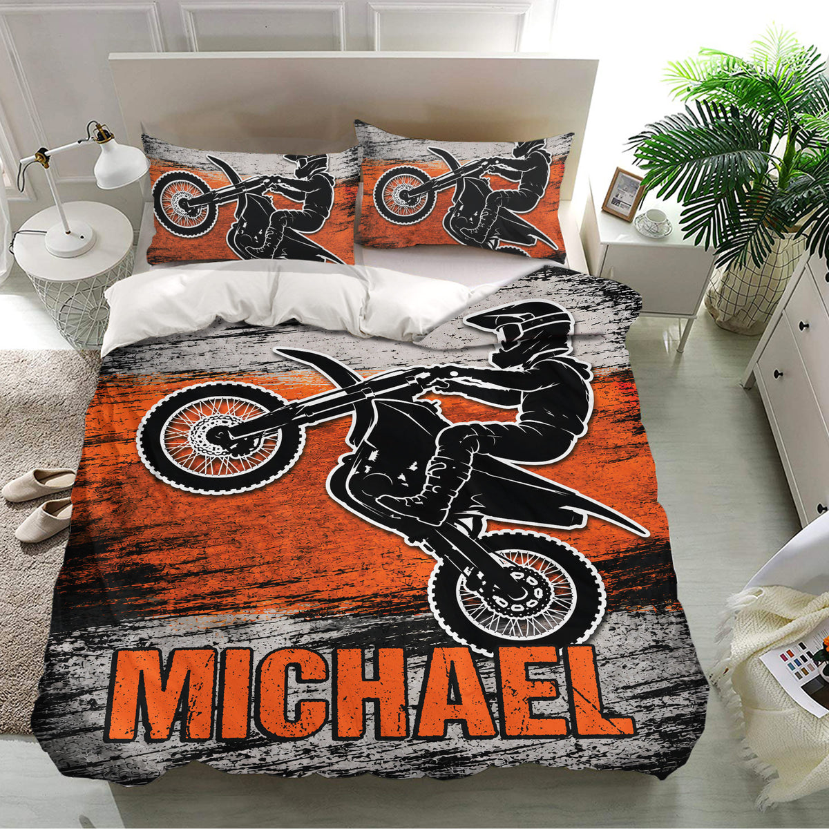 Motocross bedding set displayed in a bright bedroom with matching pillowcases and dynamic dirt bike graphics