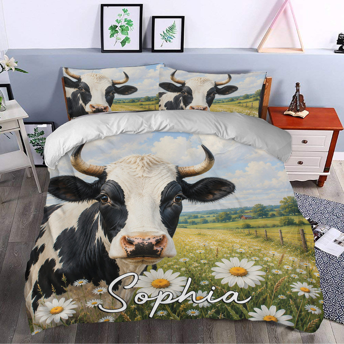 Dairy cow duvet cover styled in a bedroom with a large cow portrait, blue sky, and daisy meadow scene