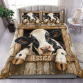 Dairy cow duvet cover set displayed on a bed with rustic wood, wheat, and farmhouse artwork