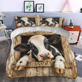 Dairy cow duvet bedding styled in a bedroom with rustic farmhouse decor and matching pillows