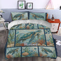 Turtle duvet cover styled in a bedroom with ocean blue sea turtle, coral, and shell artwork