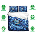 Sea turtle bedding set shown on a bed with blue ocean artwork, matching pillowcases, and feature icons