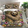 Nature-inspired sloth bedding set with floral artwork presented in a bright modern bedroom