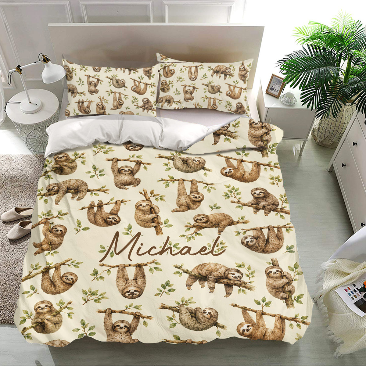 Sloth bedding set styled in a bright bedroom with matching pillowcases and repeating woodland artwork